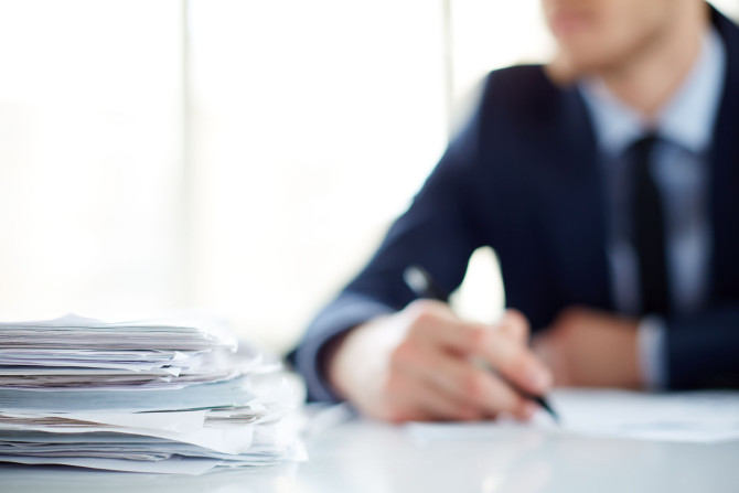 close-up-pile-papers-table.jpg