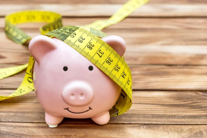 piggy-bank-with-measure-tape-wooden-background-copy-space.jpg piggy-bank-with-measure-tape-wooden-background-copy-space.jpg