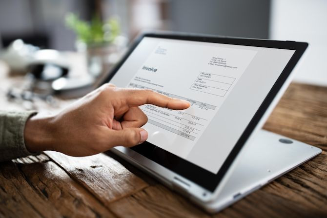 businessman-s-hands-working-invoice-laptop.jpg businessman-s-hands-working-invoice-laptop.jpg