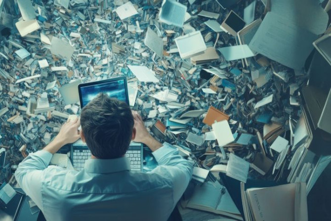 overwhelmed-man-working-amidst-sea-documents-papers-drowning-information-overload-struggling-with-data-paperwork.jpg