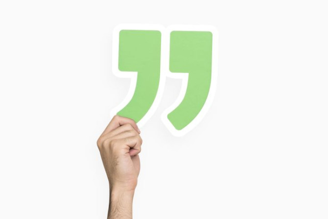hand-holding-quotation-mark.jpg