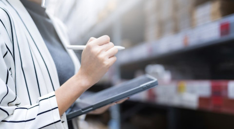 close-up-female-business-owner-hand-hold-tablet-device-checking-inventory-stock-shop-warehouse-distributor-factory-business-ideas-concept.jpg