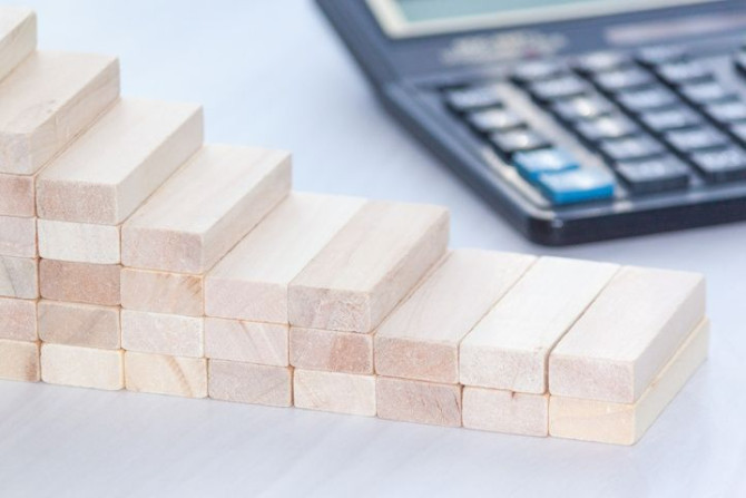 declining-graph-from-wooden-blocks-with-calculator-financial-concept-copy-space.jpg