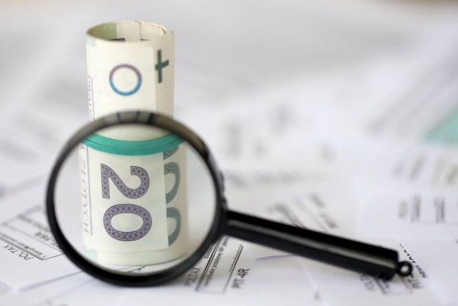 polish-zloty-money-magnifying-glass-big-amount-polish-tax-forms-close-up-accounting.jpg