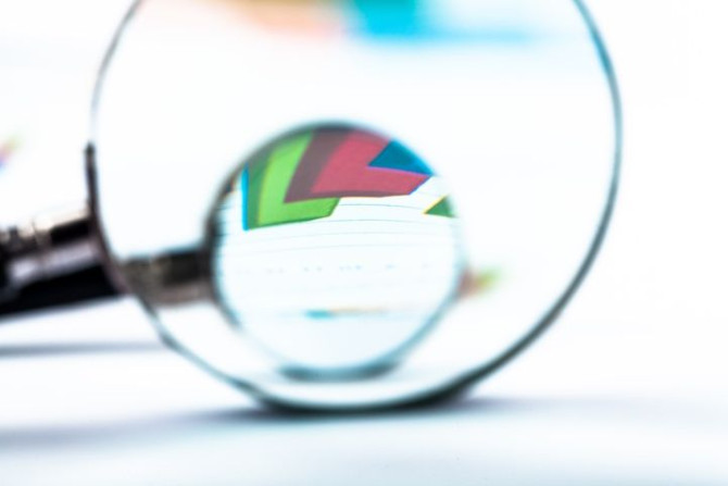 two-magnifying-glasses-document-with-graph-close-up.jpg