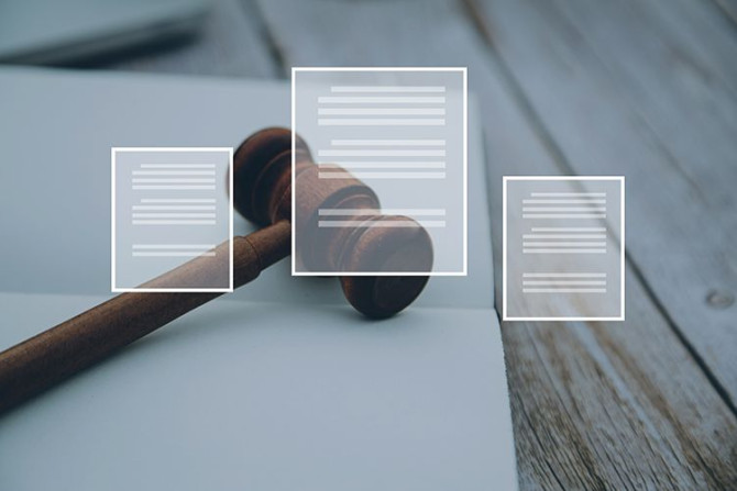 business-lawyers-discussing-contract-papers.jpg
