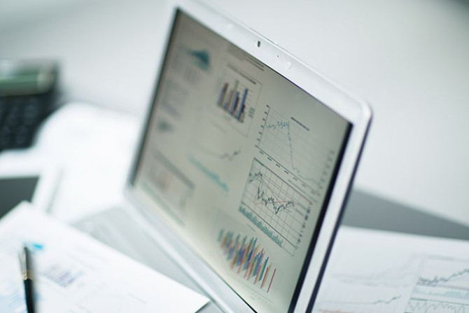 businessman-analyzing-investment-charts.jpg