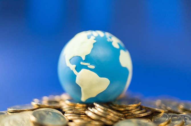 close-up-mini-world-ball-pile-gold-coins.jpg