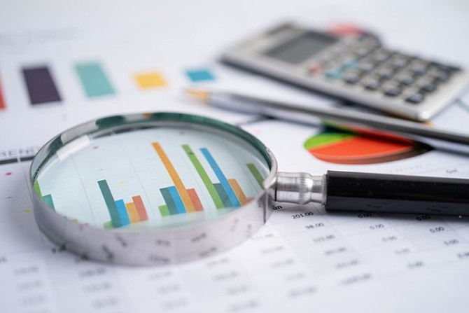 magnifying-glass-charts-graphs-paper.jpg